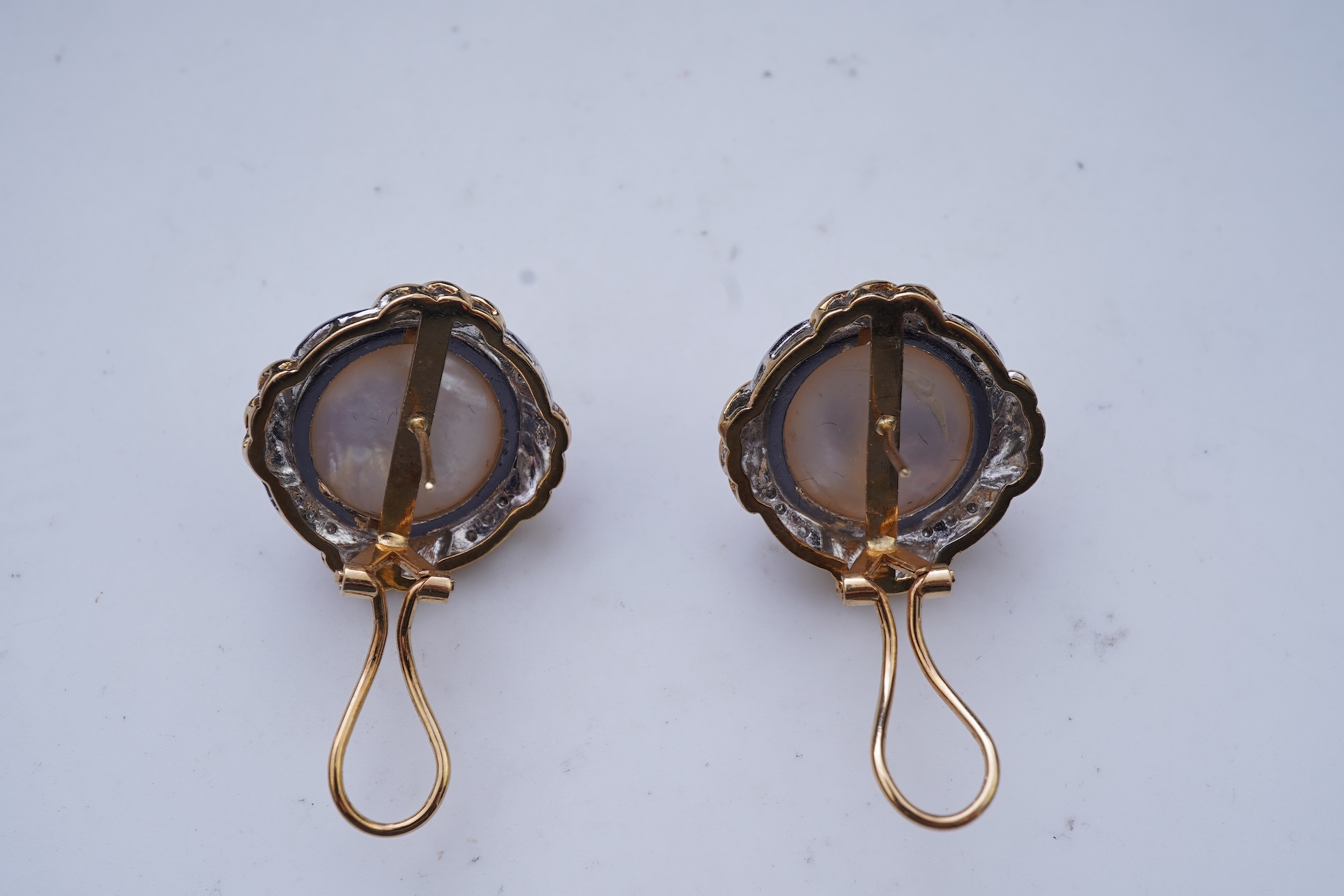 A pair of mabé cultured pearl and diamond earrings